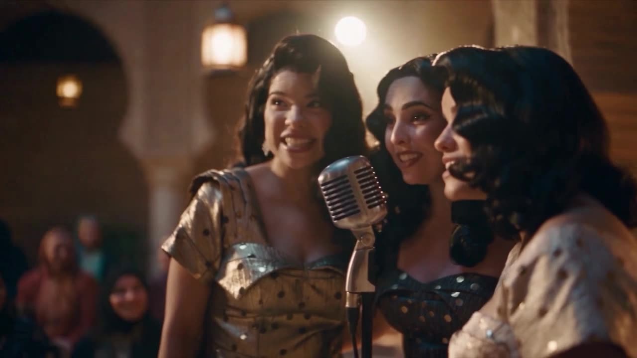 Performers singing at a vintage microphone